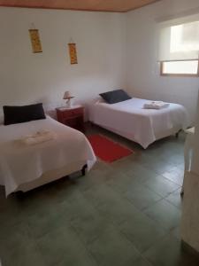 Postel nebo postele na pokoji v ubytování Hostería Altas Cumbres