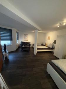 a bedroom with a bed and a desk in it at Apartment Kompakt Gottschalk 3,0 in Kassel