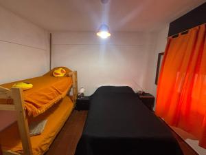 Postel nebo postele na pokoji v ubytování Departamento Las Toninas MOMA