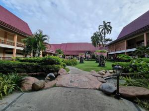 a walkway in front of a building with a resort at D Savoy A Famosa 2 BR by Oasis in Kampong Pulau Sebang