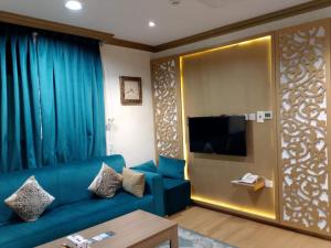 TV a/nebo společenská místnost v ubytování فندق غمامة للشقق المخدومة GHAMAMA Hotel Serviced Apartments