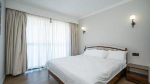 Postel nebo postele na pokoji v ubytování Apple Tree Apartment close to the Airport & SGR Terminal Nairobi