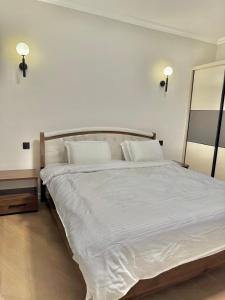 Postel nebo postele na pokoji v ubytování Apple Tree Apartment close to the Airport & SGR Terminal Nairobi
