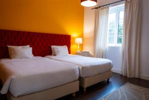 Un ou plusieurs lits dans un hébergement de l'établissement Casa Villa Cottage