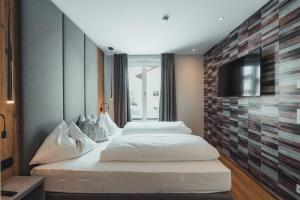Posteľ alebo postele v izbe v ubytovaní Seekarspitz Boutique Appartements