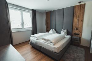Posteľ alebo postele v izbe v ubytovaní Seekarspitz Boutique Appartements