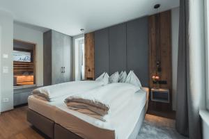 Posteľ alebo postele v izbe v ubytovaní Seekarspitz Boutique Appartements