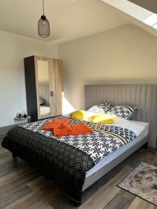 a bedroom with a large bed in a room at Jardin de Victor Appartements calmes spacieux avec jardin clos in Belfort