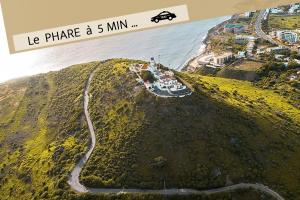 an aerial view of a small island with the ocean at La MAISON BLANCHE - Ch1A - CENTRAL - CALME - WIFI - White Butterfly Hostel in Dakar
