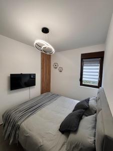 Giường trong phòng chung tại Apartman Kala Divčibare