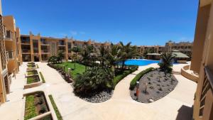 an apartment complex with a courtyard with a swimming pool at Sunset house Cabo Verde in Santa Maria
