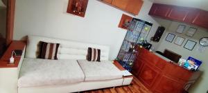 Ένα ή περισσότερα κρεβάτια σε δωμάτιο στο Hostal LUNA DE SAN ANTONIO PUNO +4 φωτογραφίες