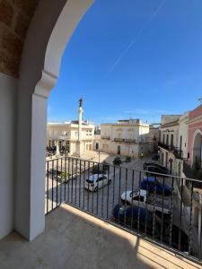 a balcony with a view of a parking lot at La casa della nonna - Guesthouse in Castrignano del Capo