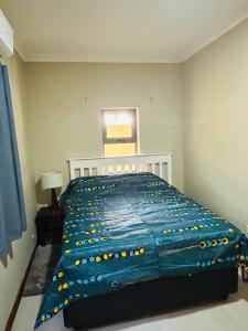 Postel nebo postele na pokoji v ubytování Grey Mango + 7 fotografií