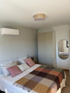 Ένα ή περισσότερα κρεβάτια σε δωμάτιο στο Apartamentos Los Riscos