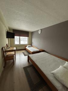 Postel nebo postele na pokoji v ubytování Hotel Talsi