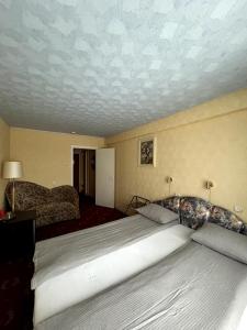 Postel nebo postele na pokoji v ubytování Hotel Talsi