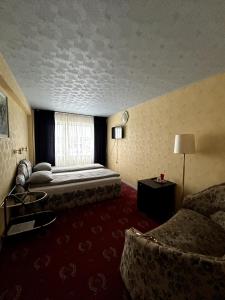 Postel nebo postele na pokoji v ubytování Hotel Talsi