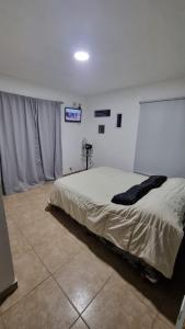 Ένα ή περισσότερα κρεβάτια σε δωμάτιο στο Lucila suites bosque