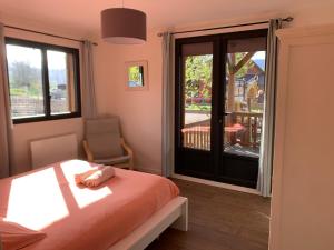 En eller flere senge i et værelse på Chalet d'Auvergne - chalet de Perrine