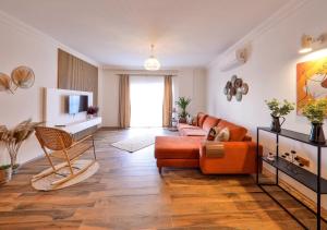 a living room with a couch and a chair at Nodus Tollens Apart in Kaş