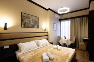 Postel nebo postele na pokoji v ubytování Guest House Shtaka