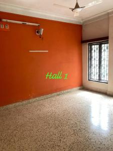 an empty room with a wall with the word hell written on it at decent home stay in Belgaum