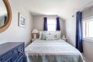 Voodi või voodid majutusasutuse Sherman Cottage on the Beach toas