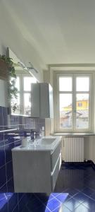 a kitchen with a large island in the middle at Il Giardino Segreto in Biella