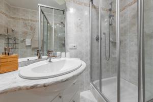 a bathroom with a sink and a shower at Apartment Ciasa Laoi in San Cassiano +73 photos