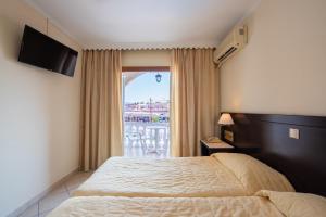 Voodi või voodid majutusasutuse Aphrodite Beach Hotel Corfu toas
