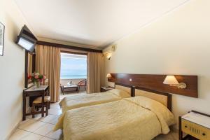 Voodi või voodid majutusasutuse Aphrodite Beach Hotel Corfu toas