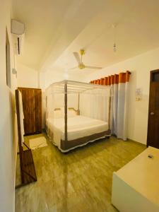 Letto o letti in una camera di Lake View Villa - Tangalle