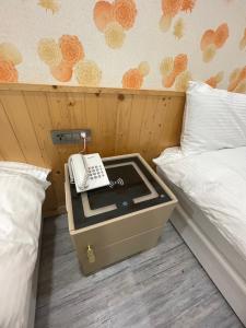 เตียงในห้องที่ 成都壹壹壹商旅