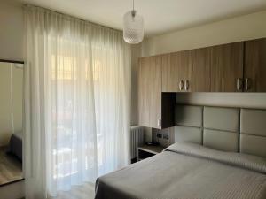 Postel nebo postele na pokoji v ubytování Cà Masawalsa Hotel