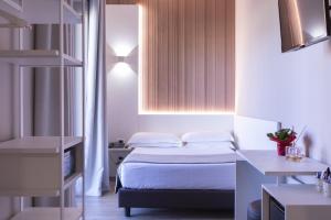 Postel nebo postele na pokoji v ubytování Garner Hotel Rome Aurelia by IHG
