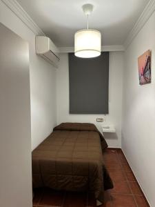 Postel nebo postele na pokoji v ubytování Apartamentos Maria