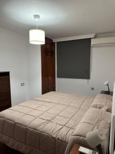 Postel nebo postele na pokoji v ubytování Apartamentos Maria