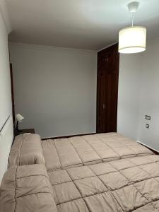 Postel nebo postele na pokoji v ubytování Apartamentos Maria