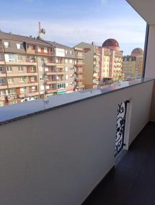 a balcony with a view of some buildings at Stan na dan Brcko -The Gold Nook in Brčko