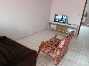 Μια τηλεόραση ή/και κέντρο ψυχαγωγίας στο casa de temporada Império 1