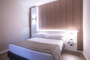 Postel nebo postele na pokoji v ubytování Garner Hotel Rome Aurelia by IHG