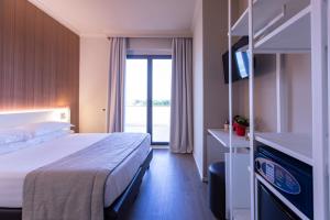 Postel nebo postele na pokoji v ubytování Garner Hotel Rome Aurelia by IHG