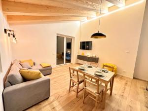 a living room with a couch and a table at Cá de Lares in Peio