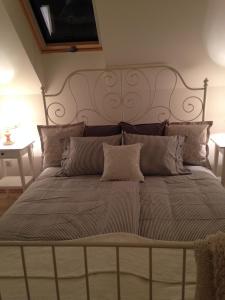 a large bed with a large headboard in a room at Premium "Vintage" Apartment in Zalaszentmihály