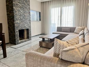 Posezení v ubytování Grand Appartement Vue mer à Ain Diab - Calme Absolu