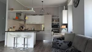 a kitchen with white cabinets and a counter top at Welcome home in Terni