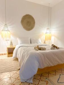 Postel nebo postele na pokoji v ubytování Eco Bay Surf House