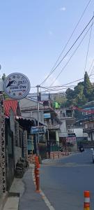 a street with a sign on the side of the road at Ang Ds Homestay in Sonāda