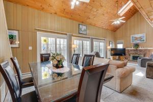 a dining room with a glass table and chairs at Near Hiking and Skiing Home in Wilmington! in Wilmington